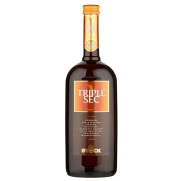 Bottiglia di Triple Sec Stock, liquore all’arancia dal profumo agrumato, ideale per cocktail e long drink.